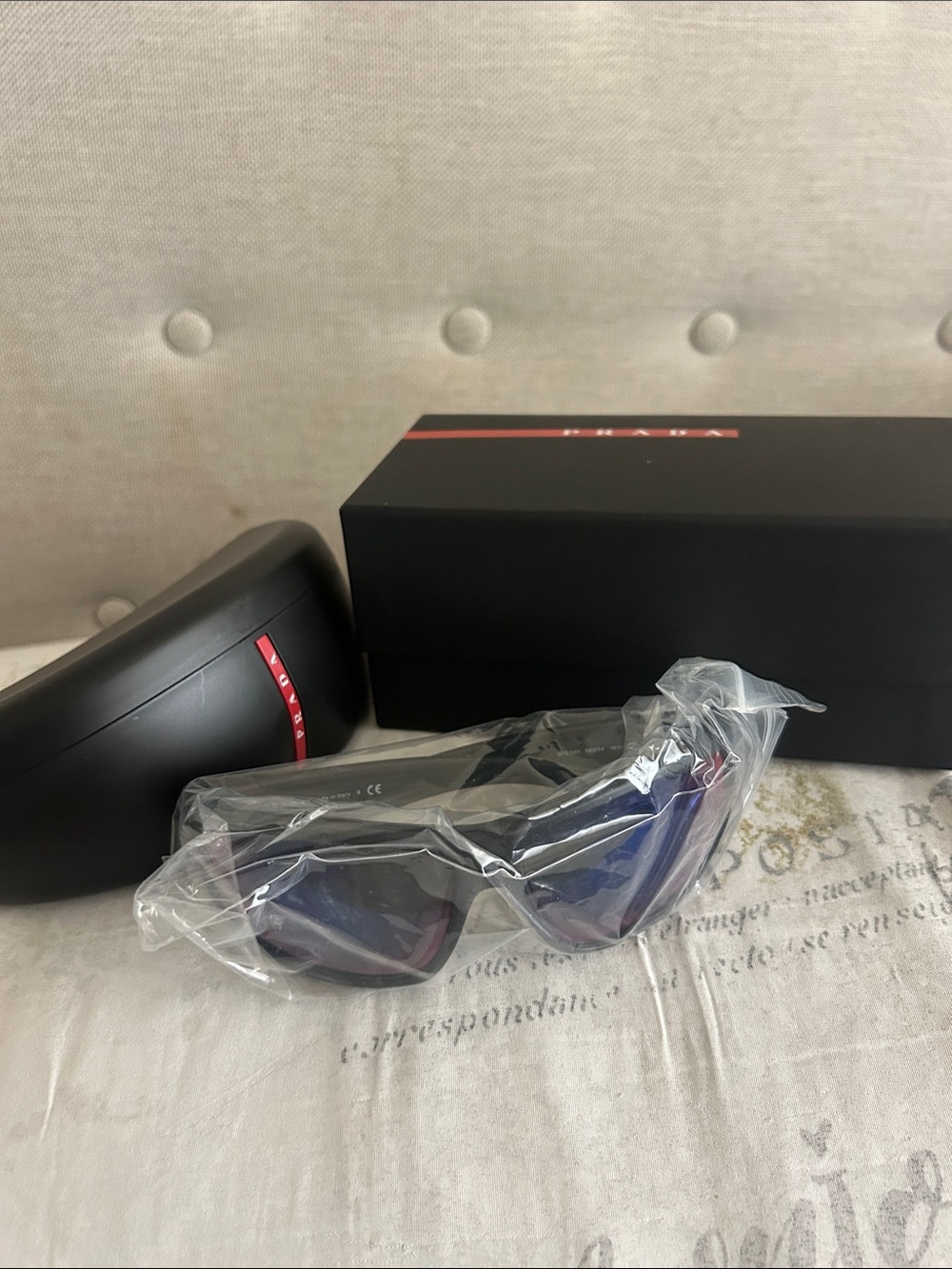 Prada Black Frame Sunglasses with Blue Lenses